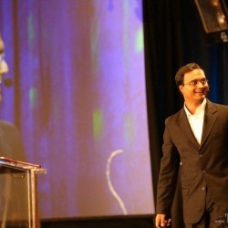 Praveen Narra laughs as he speaks