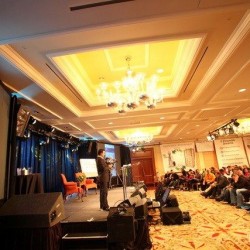 Praveen Narra speaking at a Financial Seminar