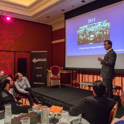 Praveen Narra speaking at The Next Level Experience in Las Vegas