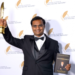Praveen Narra receiving Quilly Award for his Book