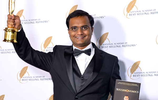 Praveen Narra receiving Quilly Award for his Book