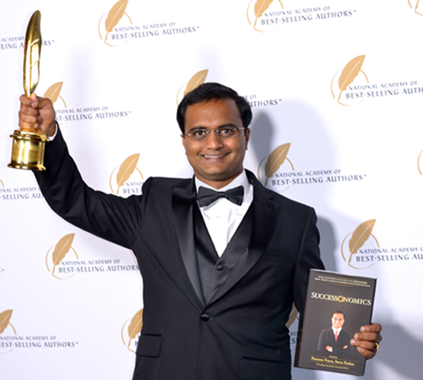 Praveen Narra receiving Quilly Award for his Book